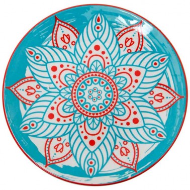 Vajilla de porcelana en tonos azules con dibujo mandala en el centro.