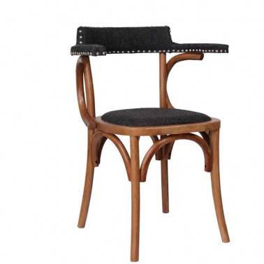 Silla comedor de madera con asiento y respaldo tapizado.
